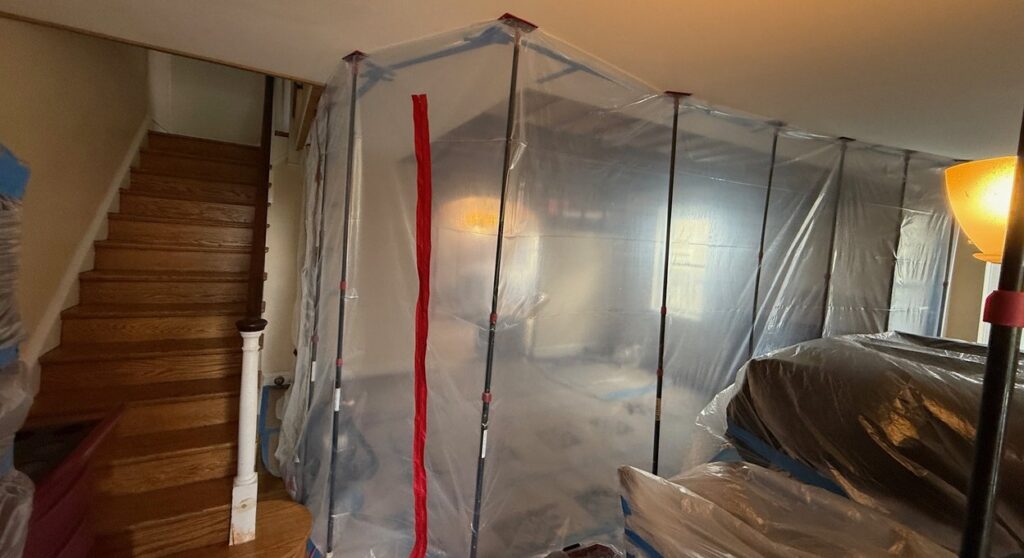 Plastic containment set up by Pro Home Restorations before mold removal